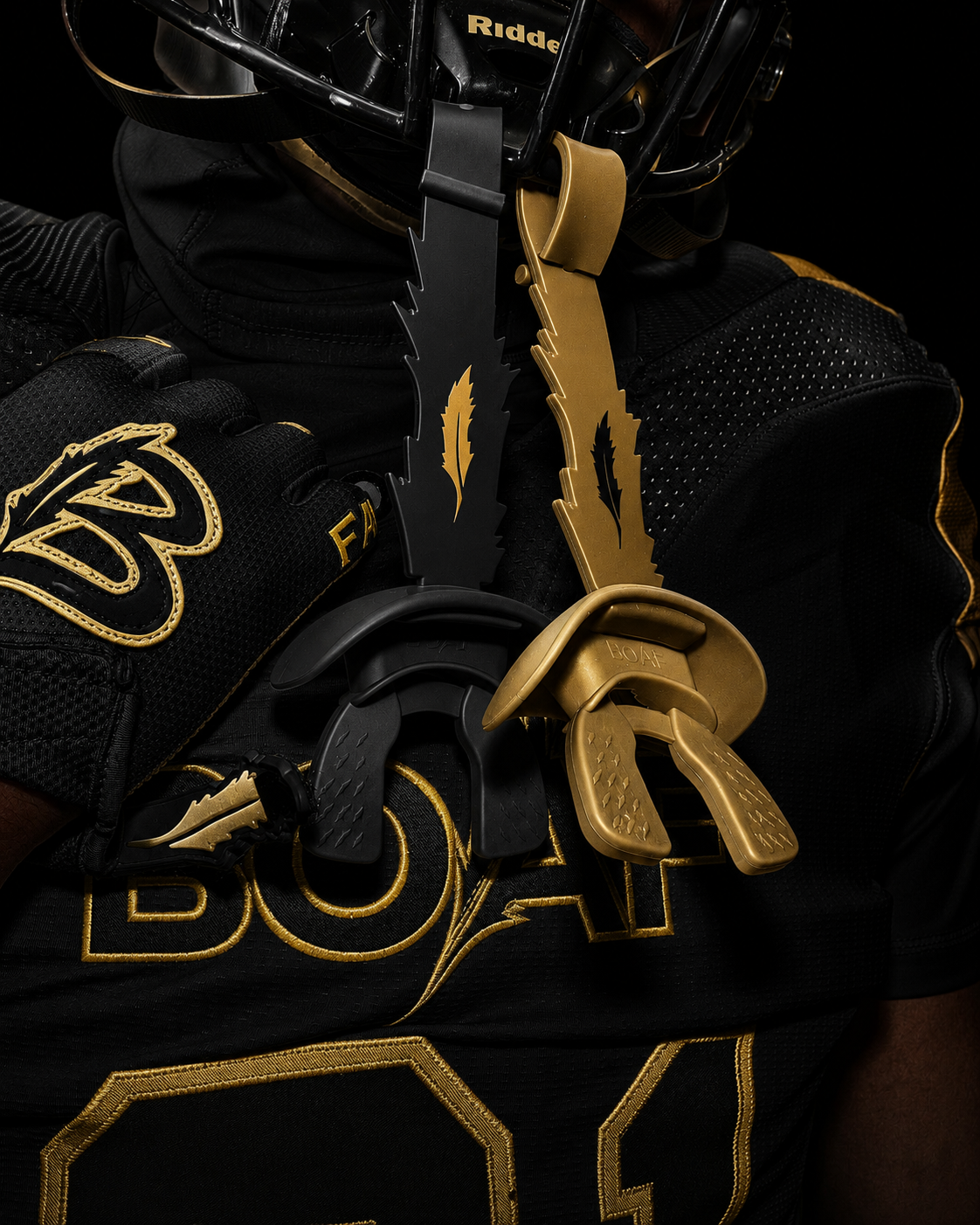 Close-up of BOAF branded mouthguards and uniform detail in gold